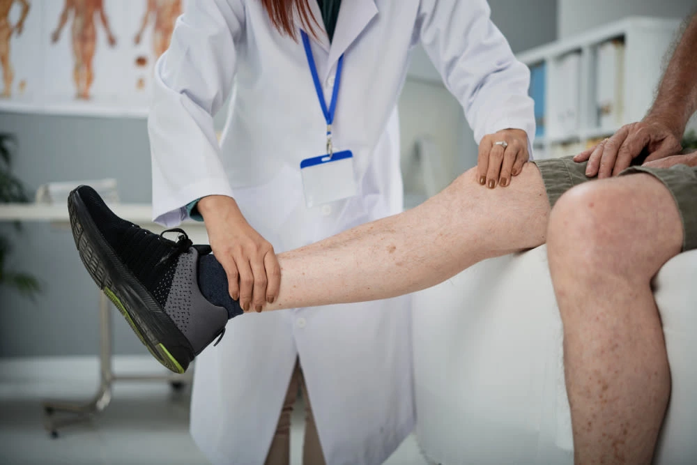 Healthcare professional wrapping patient’s ankle with bandage for sports injury care in Central Florida