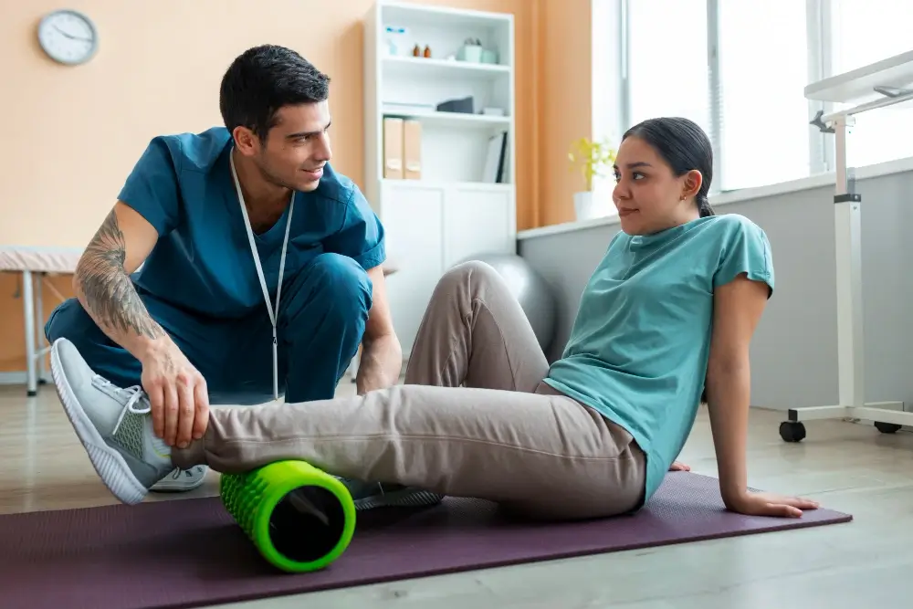 Athlete holding an injured ankle during a sports activity requiring professional foot and ankle trauma care in Central Florida